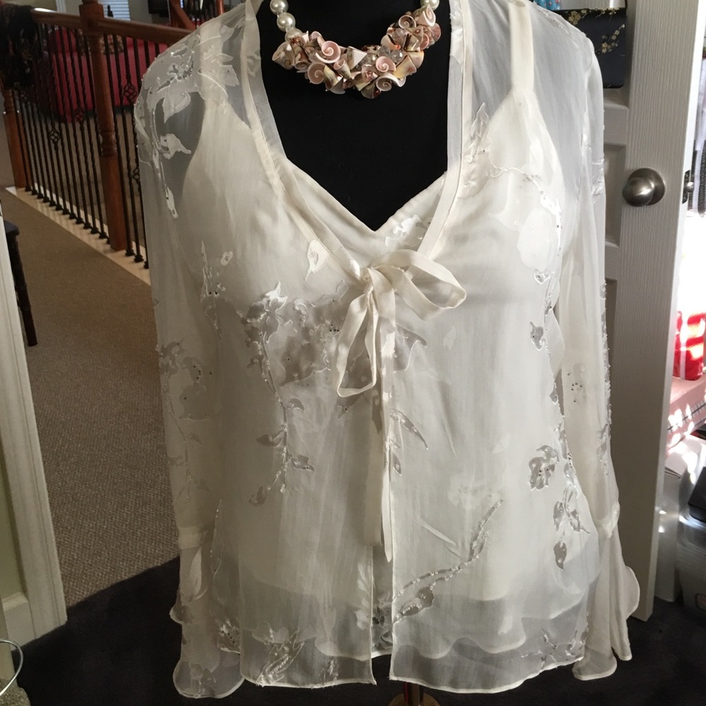 Pretty sheer genius creamy white top!